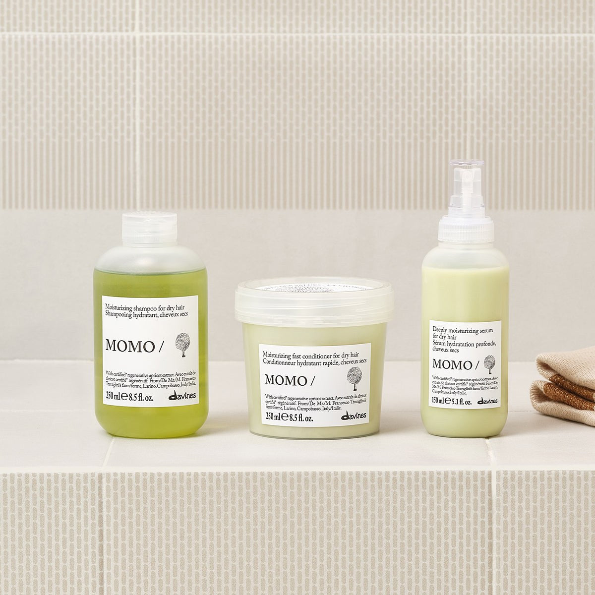 Davines MOMO Shampoo with the MOMO range on a bathroom shelf