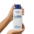 Eucerin UreaRepair 5% Urea Moisturizing Lotion 250ml in hand